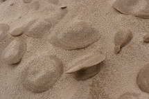 clumps of sand on a beach 