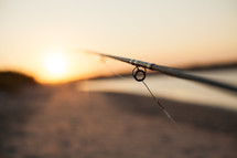 fishing pole at sunset 