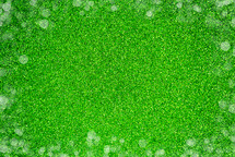 green Glitter Background with bokeh dots 