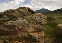a man rock climbing up a cliff