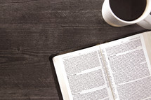 open Bible and coffee mug 