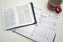 open Bible, notebook, journal, coffee mug