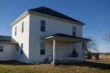 white farm house in rural area