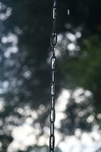 water dripping down a chain 