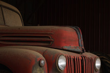 Red, vintage truck in a barn