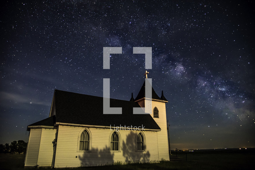 stars over a church at night 