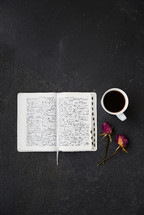 open Bible, dried roses and coffee cup 