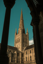 Norwich Cathedral spire, beautiful historic building, stunning architecture, tall tower place of worship blue sky
