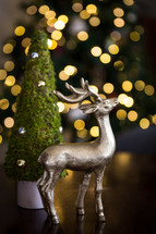 deer figurine and bokeh Christmas lights 