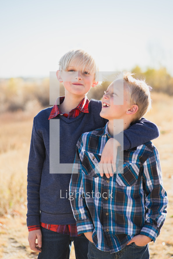 portrait of brothers outdoors 