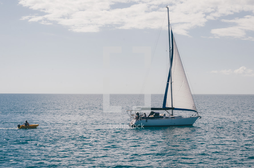 a sailing boat on the ocean