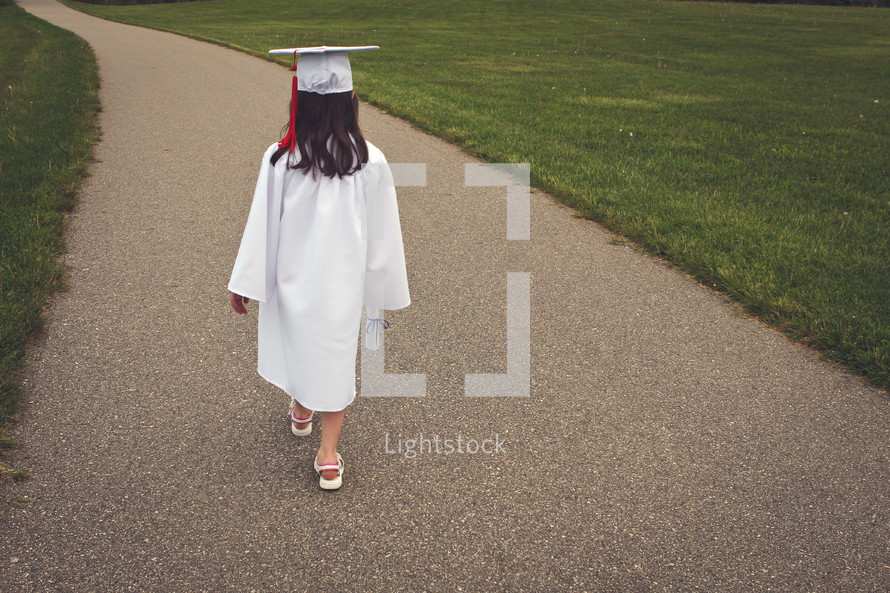 a graduate carrying a diploma 