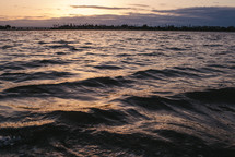 ripples in water at sunset 