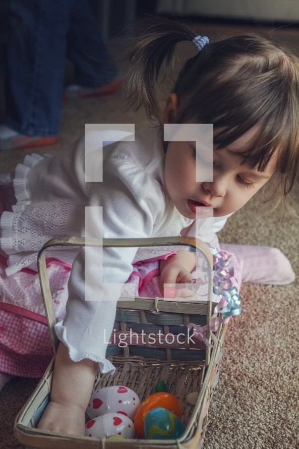 toddler girl with an Easter basket 