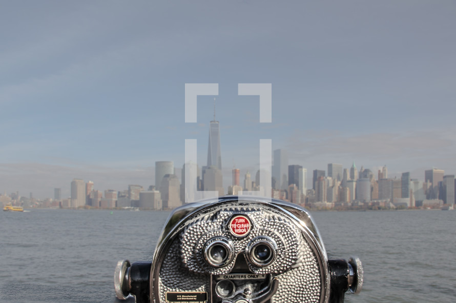 a viewfinder scope looking out at a city 