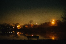 lights around a pond at night 