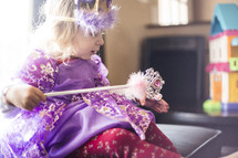 a little girl dressed up like a princess 