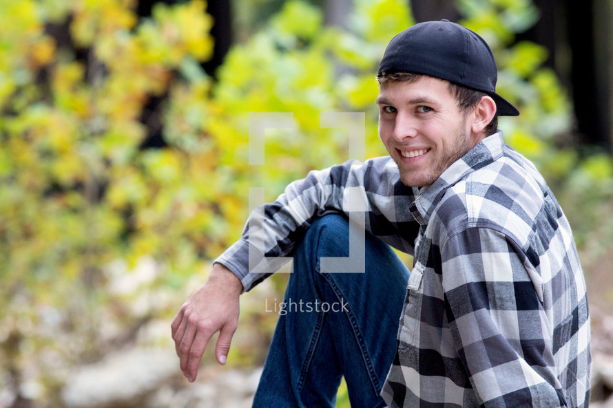 young man with a backwards hat 