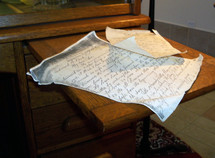 A hand written letter like the letters that Paul wrote to the churches in the New Testament or a personal letter or manuscript hand written in cursive writing.
