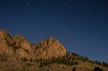 stars above the Rocky Mountain range.