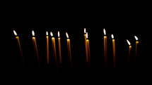 row of burning candles 