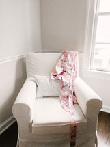 silk robe on a white arm chair 