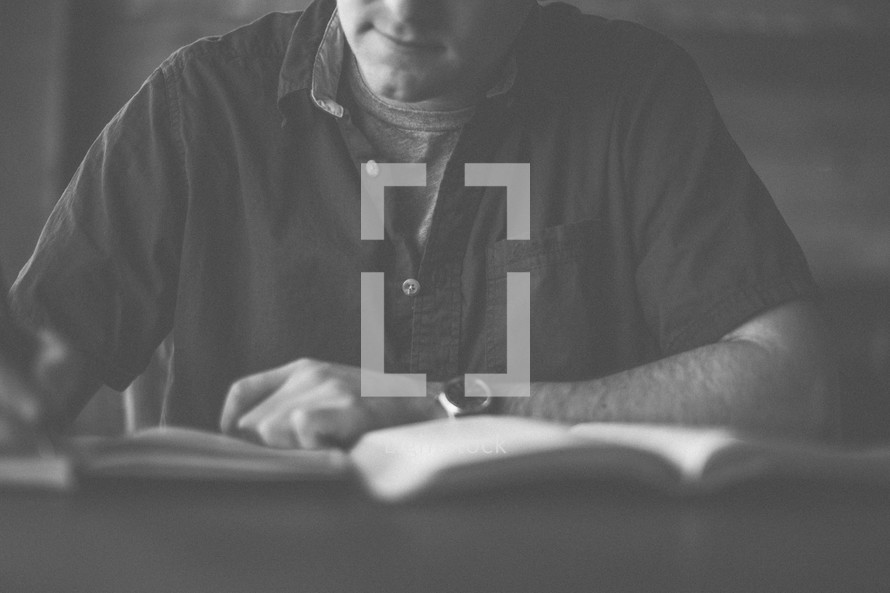 A man taking notes during a bible study