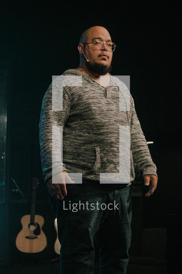 worship leader standing on stage 