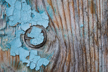Blue paint on the wooden surface