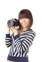 a girl holding a large camera 