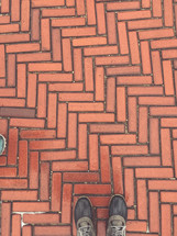 herringbone patterned bricks and duck boots 