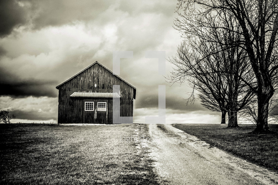 rural barn under a cloudy sky 