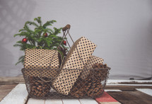pine cones and presents in a basket 