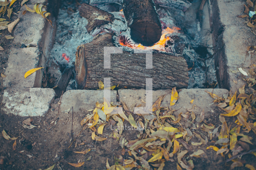 ashes and embers in a fire pit 