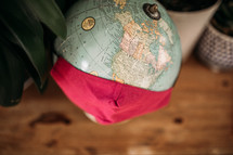face mask over a globe 