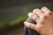 wedding band on a woman's finger