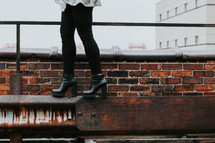 balancing in heels on a roof 