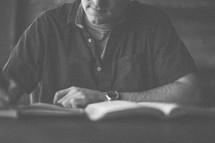 A man taking notes during a bible study
