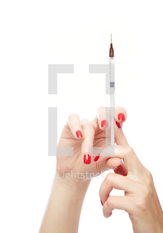 a woman holding a needle 