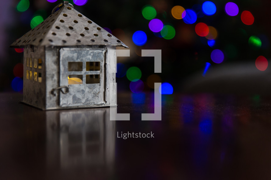 candle lantern and bokeh Christmas lights 