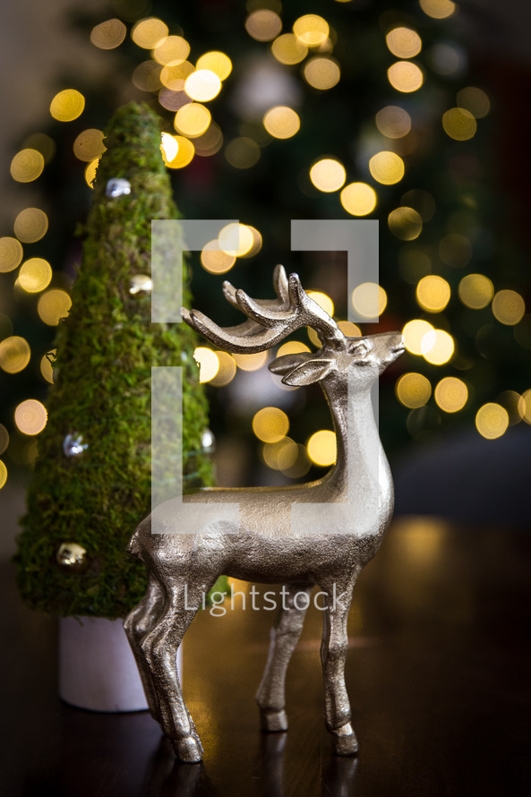 deer figurine and bokeh Christmas lights 