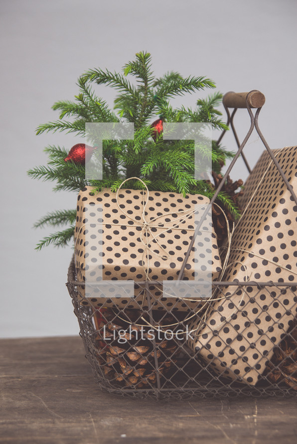 pine cones and presents in a basket