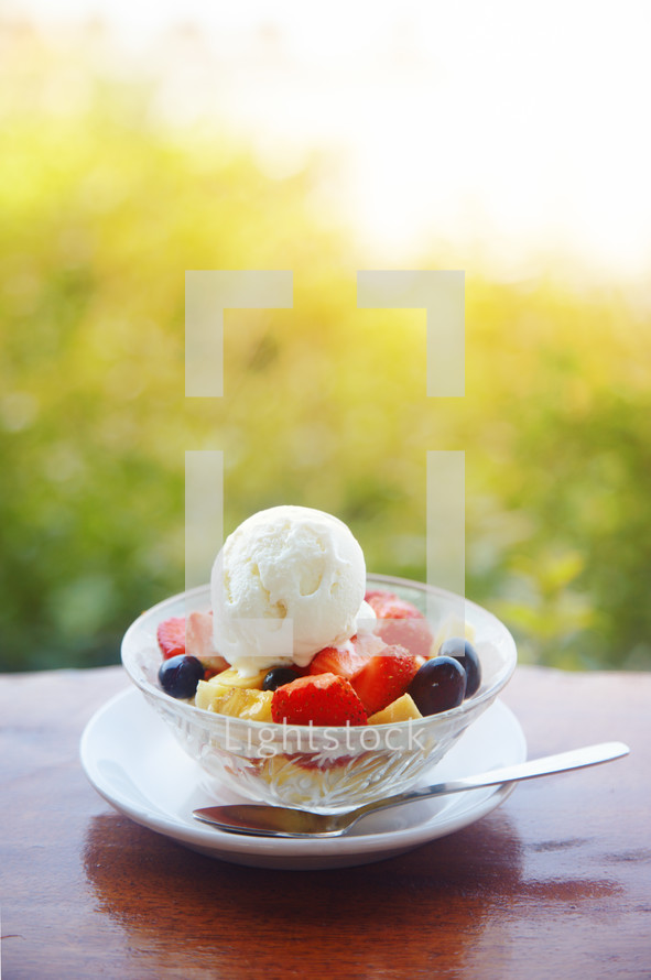 bowl of fruit with ice cream 