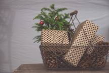pine cones and presents in a basket 