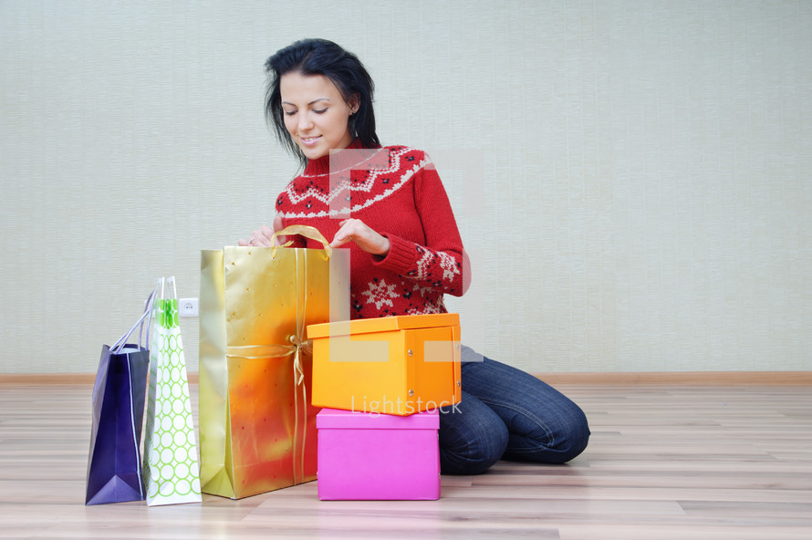 a woman with many gift bags 