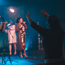 worship leaders on stage playing music 