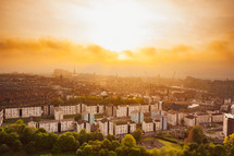 golden clouds in the sky over a city in Europe at sunset 