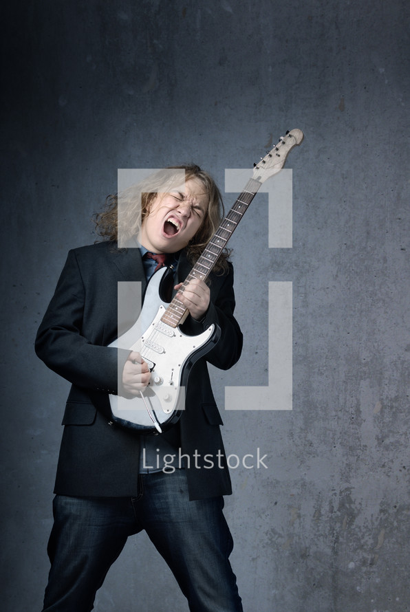 man jamming on a guitar 