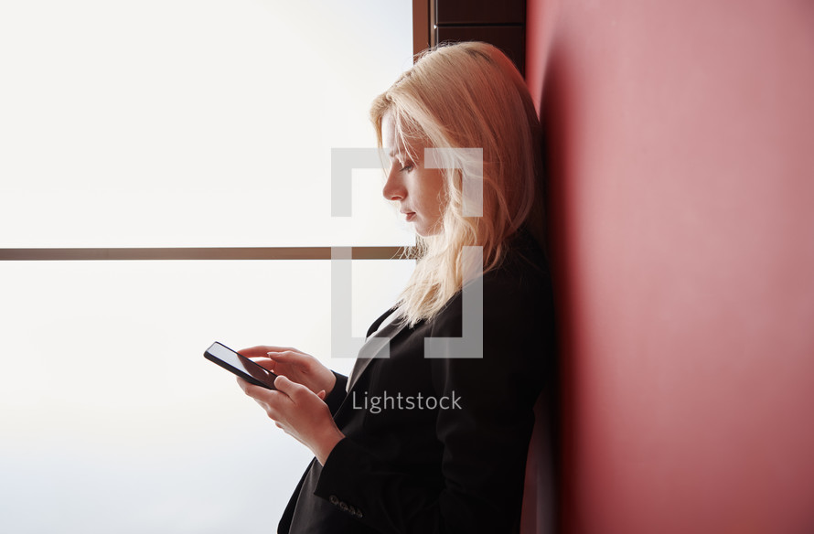 a businesswoman texting 