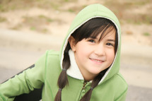 girl child with pigtails in a hoodie